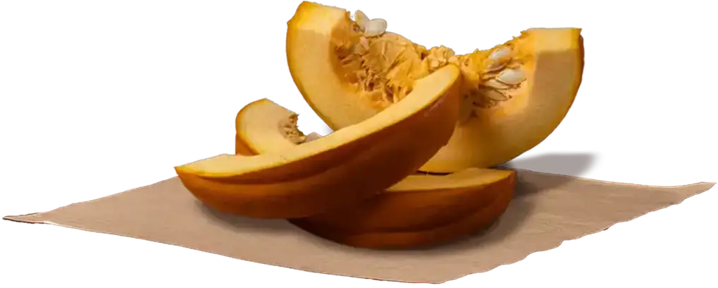 Fresh pumpkin slices on paper